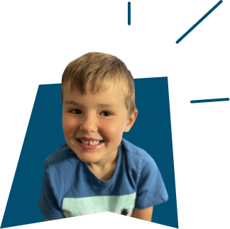 A smiling young boy wearing a blue t-shirt, set against a blue background with graphic rays.