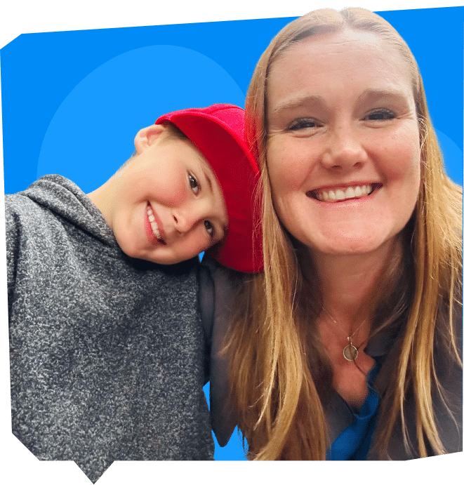 A woman and a boy are smiling together, with the boy resting his head on her shoulder. They are set against a bright blue background.