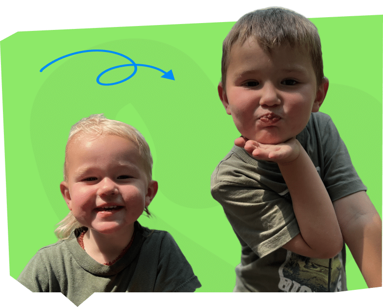 The child on the left has light hair and is smiling widely, while the child on the right is making a playful blowing a kiss gesture.